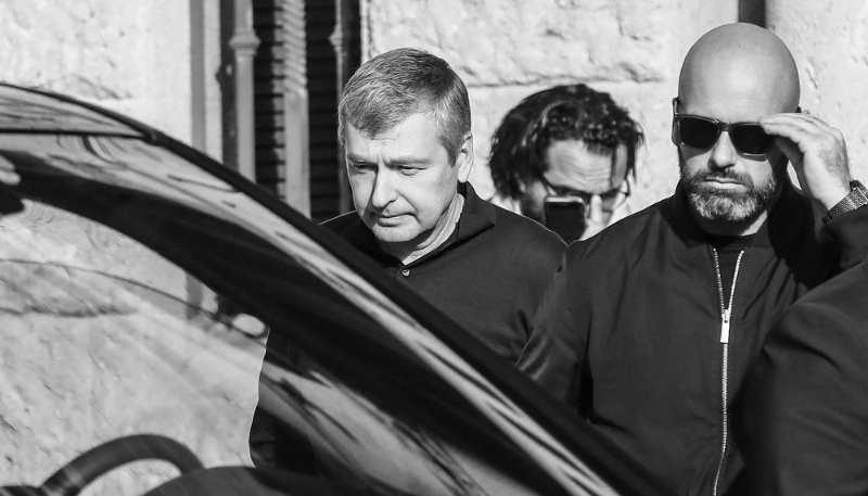 Russian millionaire Dimitry Rybolovlev (L) leaves after appearing at the Monaco courthouse on 19 October 2017.