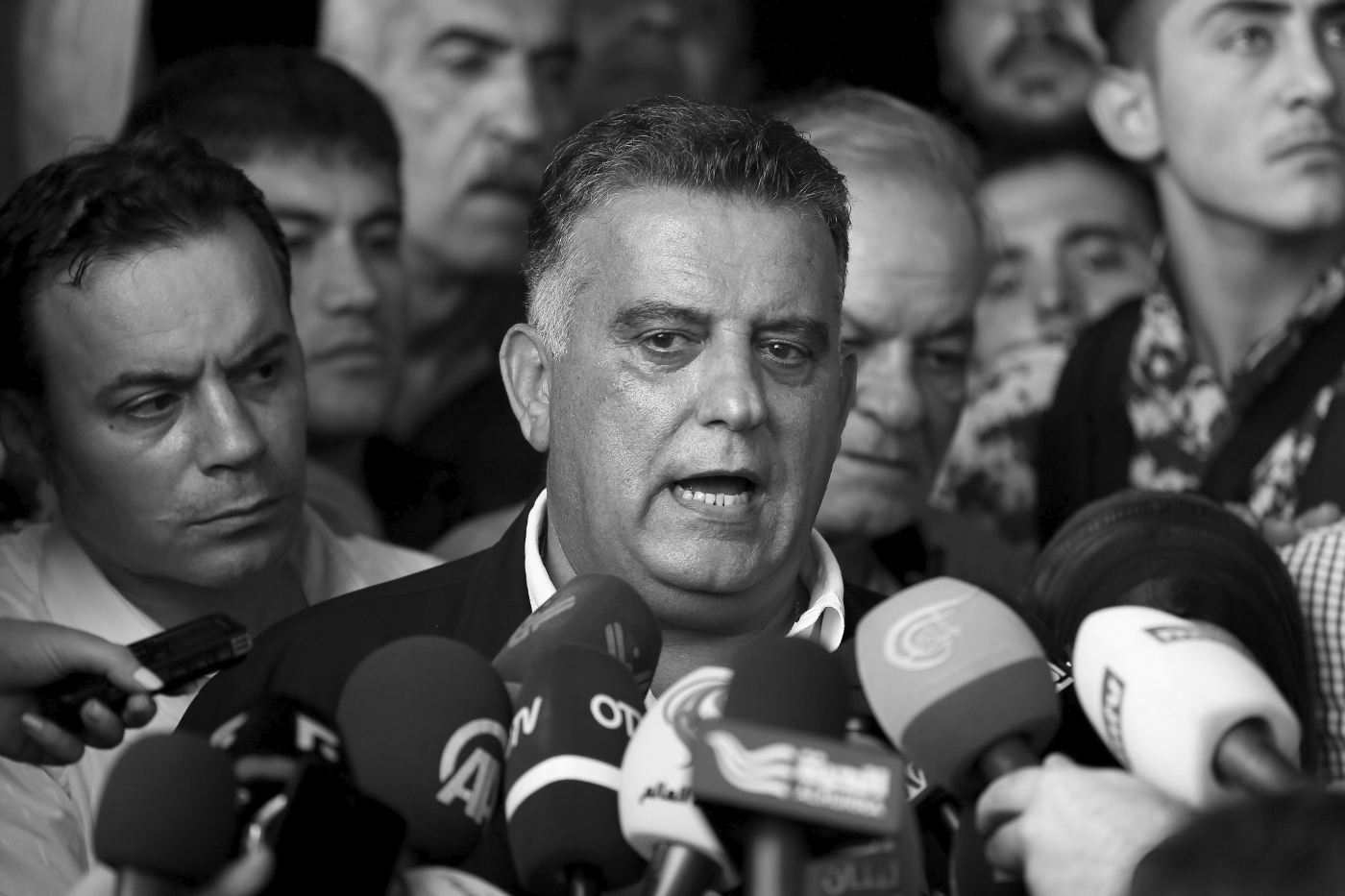 Lebanese relatives of missing soldiers surround chief of Lebanese Security General Abbas Ibrahim.