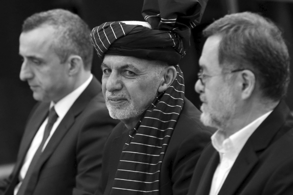 Afghan President Ashraf Ghani, surrounded by candidates Amrullah Saleh (L) and Sarwar Danish (R).