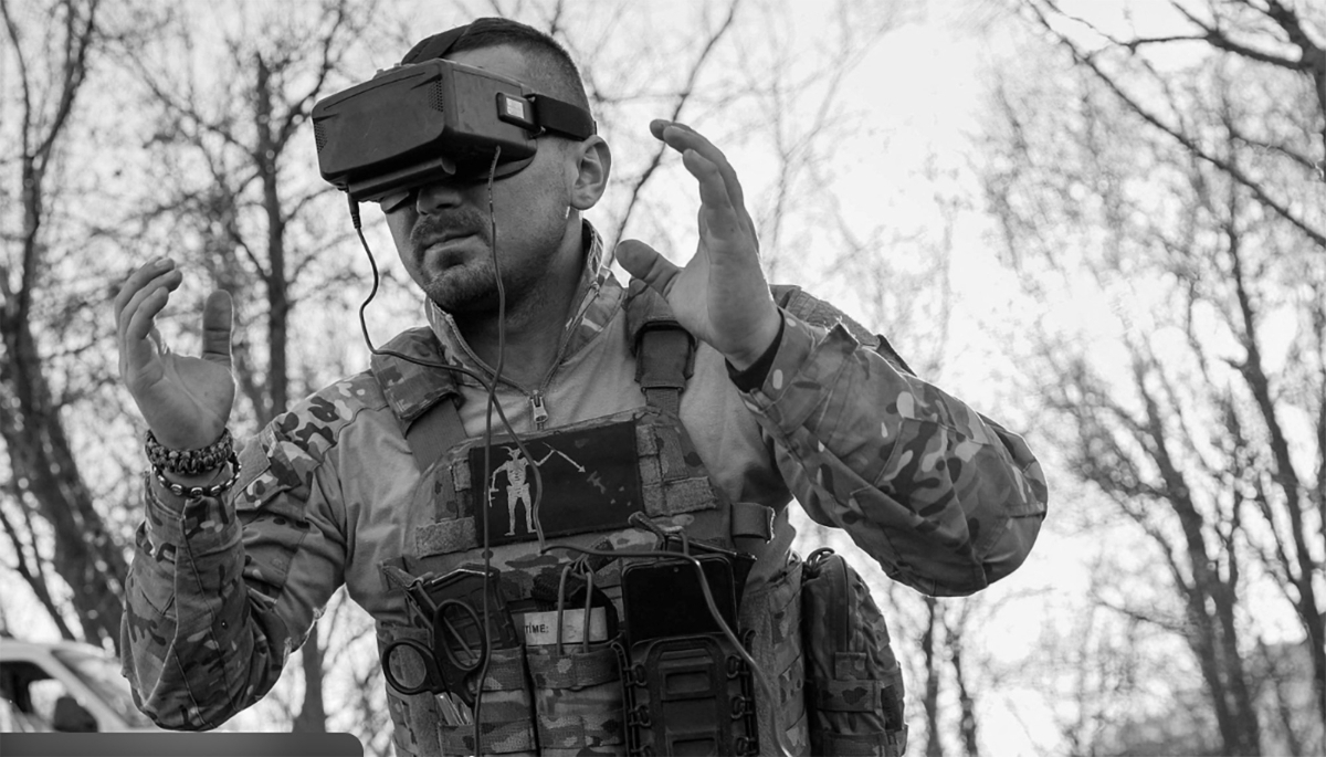 A soldier piloting a First-Person View (FPV) drone during training.