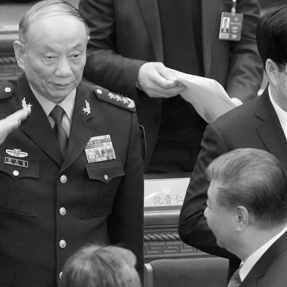 Chinese Central Military Commission Vice President Zhang Shengmin salutes Chinese President Xi Jinping.
