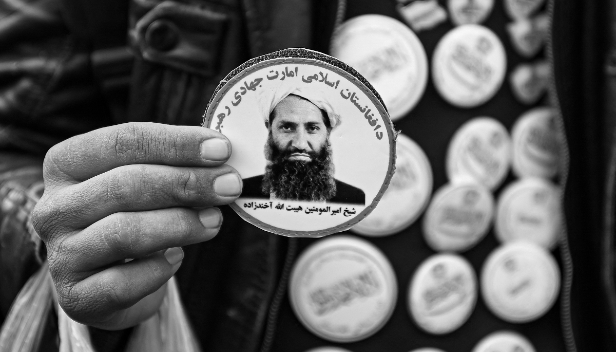 A sticker picturing Taliban supreme leader Haibatullah Akhundzada being sold at a market in Kabul, on 26 December 2021.
