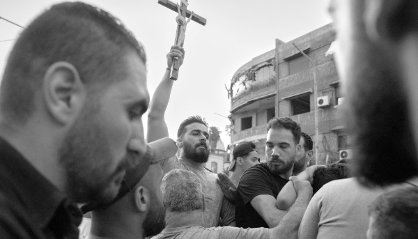 Syrians marching through Damascus after a memorial service in the Mar Elias Church the day after a suicide bomb killed 25 people on 22 June 2025.