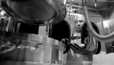 A research scientist handles a wafer in a research laboratory at the III-V Lab in Palaiseau, south of Paris, on 16 October 2024.