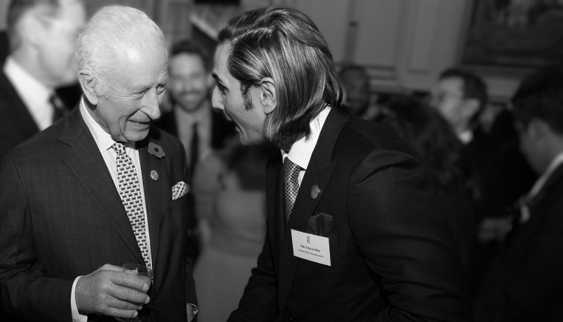 King Charles III receives a gift from guest Omar Mir at Buckingham Palace in London on 6 November 2024.