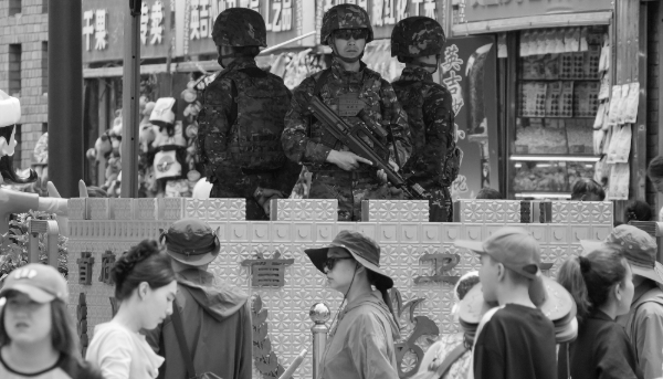 Armed police officers stand guard in Urumqi in China's Xinjiang Uyghur Autonomous Region.
