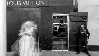 A security employee guards the entrance to a Louis Vuitton store near Union Square in San Francisco, California, on 30 November 2021.