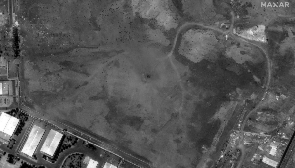 A handout satellite image made available by Maxar shows a crater over the underground facility of the Natanz nuclear enrichment facility after US airstrikes in Iran, 22 June 2025.