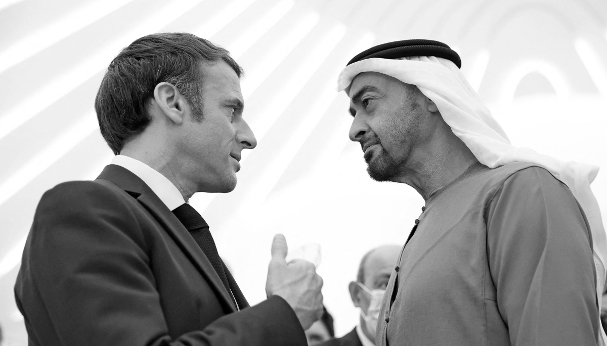 French President Emmanuel Macron is greeted by Abu Dhabi's Crown Prince Mohammed bin Zayed al-Nahyan at the Dubai Expo, on 3 December 2021.