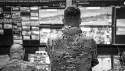 A Ukrainian SSO officer monitoring Russian troop movements on the outskirts of Dobropillia from his command post.