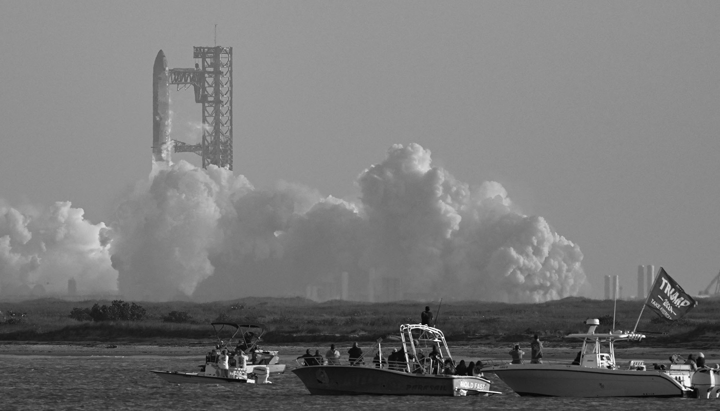 A Trump flag on a boat from where people watch SpaceX's Starship take off from the Starbase launch site near Boca Chica, Texas, on 6 March 2025.