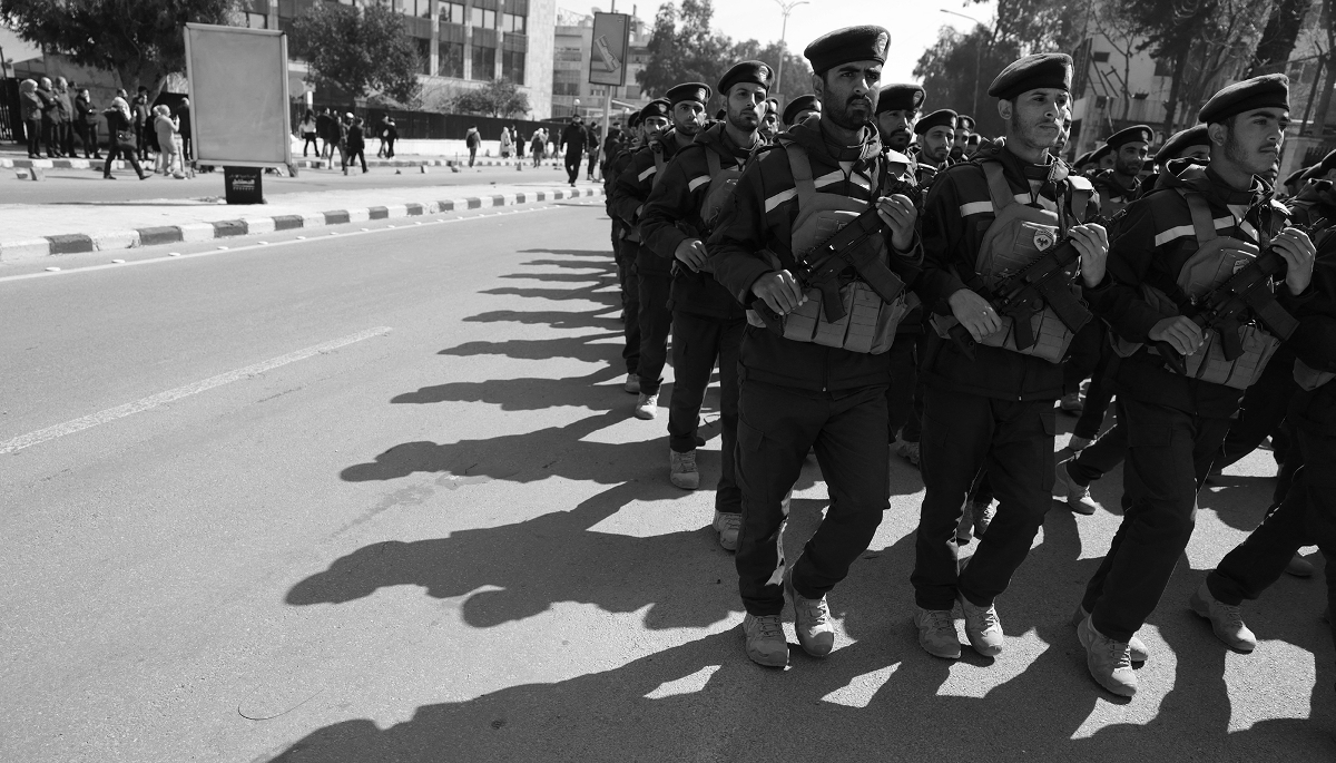 Newly-trained military and police personnel from Syria's interior ministry march toward Umayyad Square after a graduation ceremony in Damascus, Syria, on 17 March 2026.