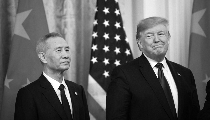 Chinese Vice Premier Liu He and American President Donald Trump stand together before signing the Phase 1 trade deal between the United States and China, during a ceremony in the East Room at the White House on 15 January 2020.