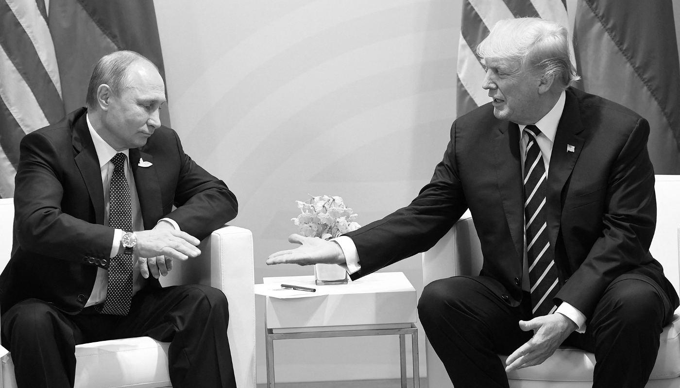 US President Donald Trump and Russia's President Vladimir Putin shake hands during a meeting on the sidelines of the G20 Summit in Hamburg, Germany, on 7 July 2017.