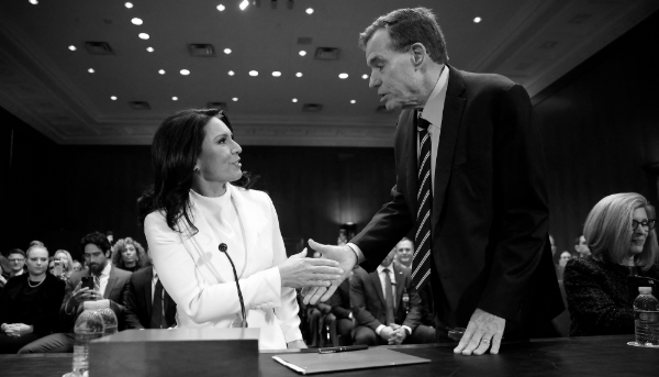 Tulsi Gabbard, U.S. President Donald Trump’s nominee to be Director of National Intelligence, greets Sen. Mark Warner as she arrives to testify during her confirmation hearing before the Senate Intelligence Committee, on 30 January 2025.