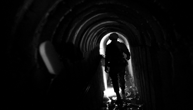 An Israeli soldier walks through what the army has described as a Hamas command tunnel in the Gaza Strip, 8 February 2024.
