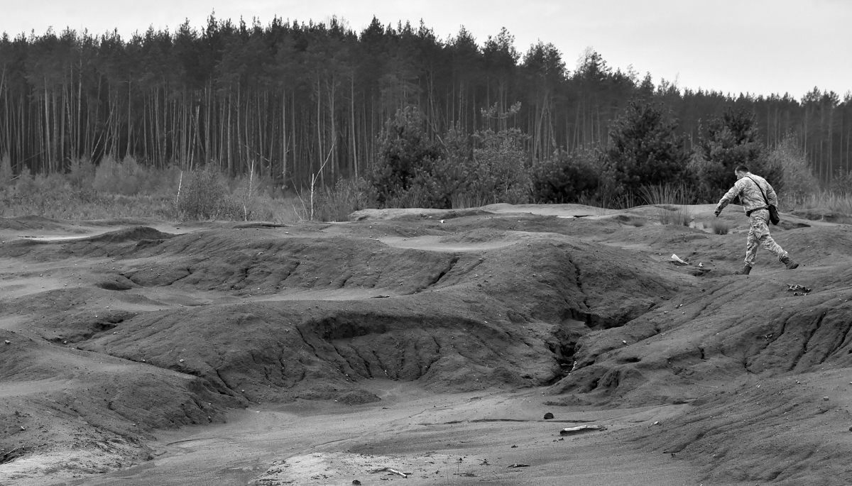A police officer takes part in the raid of an illegal amber mine near the village of Kryvytsya, northwestern Ukraine, on 22 September 2017. 