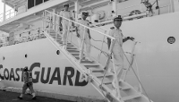 Captain Naoki Mizoguchi (right), commander of the Japanese Coast Guard vessel Itsukushima, disembarks onto a quay in Manila,The Philippines, on 16 July 2026.
