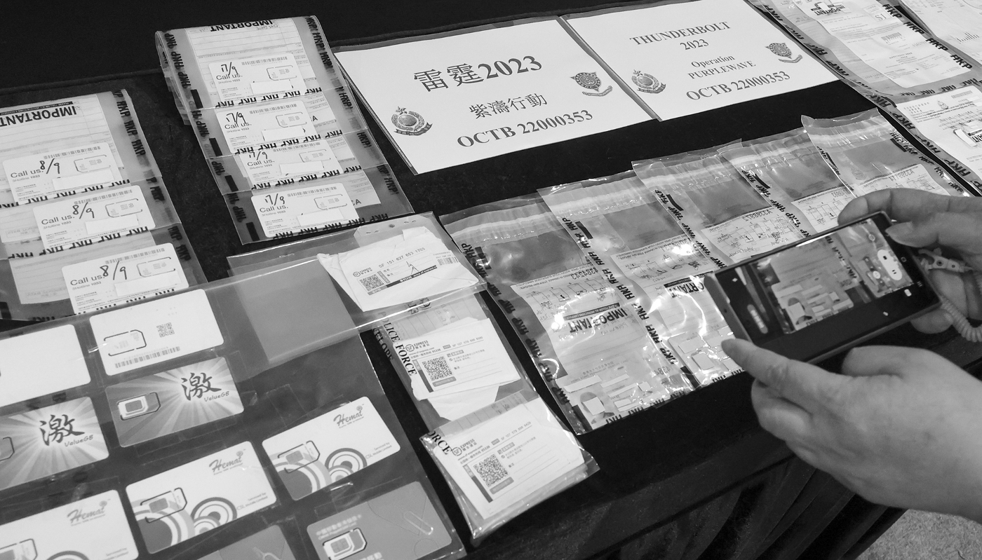 Material presented during a press conference for an operation against a cross-border criminal network trafficking forged documents, at police headquarters in Wan Chai, Hong Kong, on 20 September 2023.