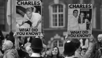 Anti-monarchy protesters holding placards bearing the image of Andrew Mountbatten-Windsor demonstrate in London on 9 March 2026. 