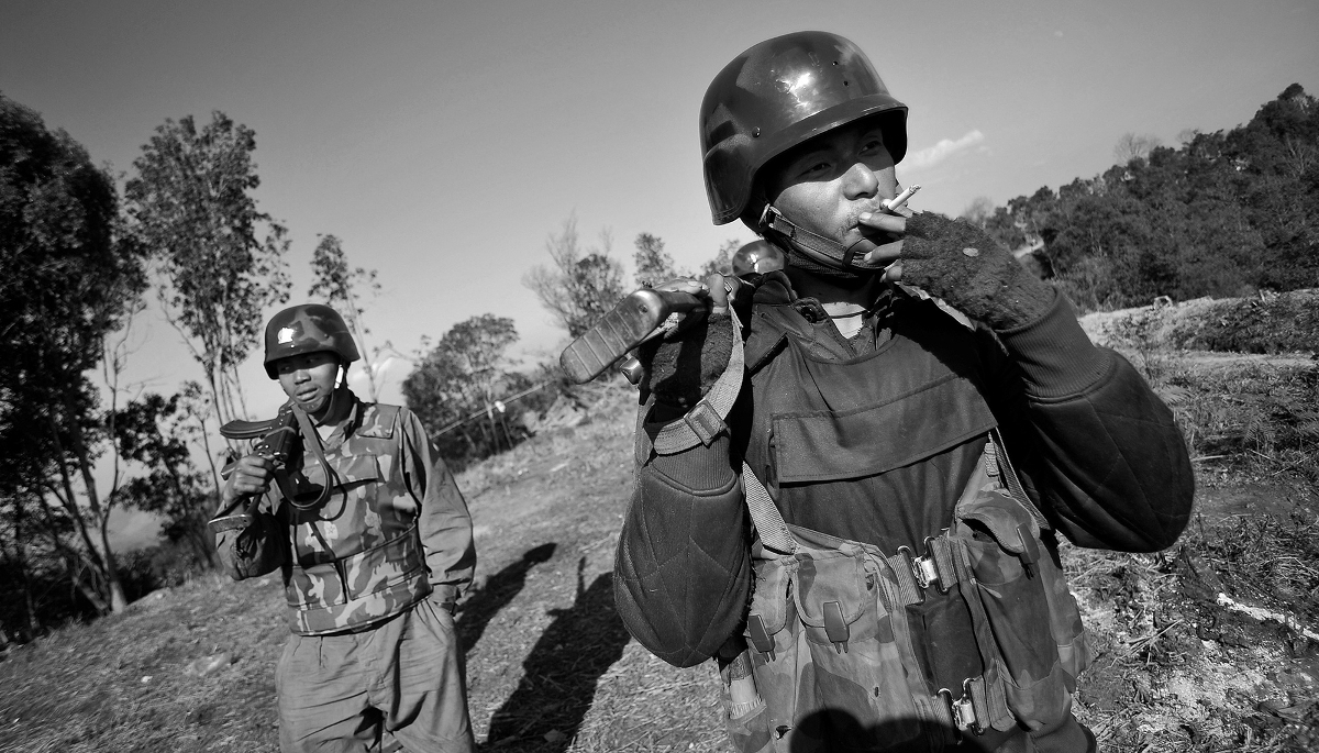 Soldiers from the Kachin Independence Army (KIA) on the front line near Mai Ja Yang, in Kachin State, Myanmar, on 22 January 2013.  
