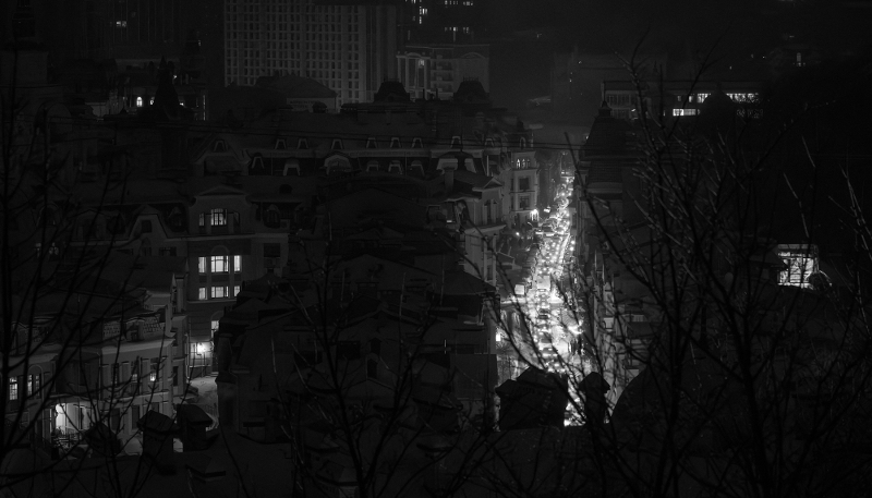 A brightly lit street in a city plunged into darkness during a power cut in Kyiv, Ukraine, on 13 January 2026. The Ukrainian capital is facing widespread power cuts due to massive combined strikes from drones and missiles every night.