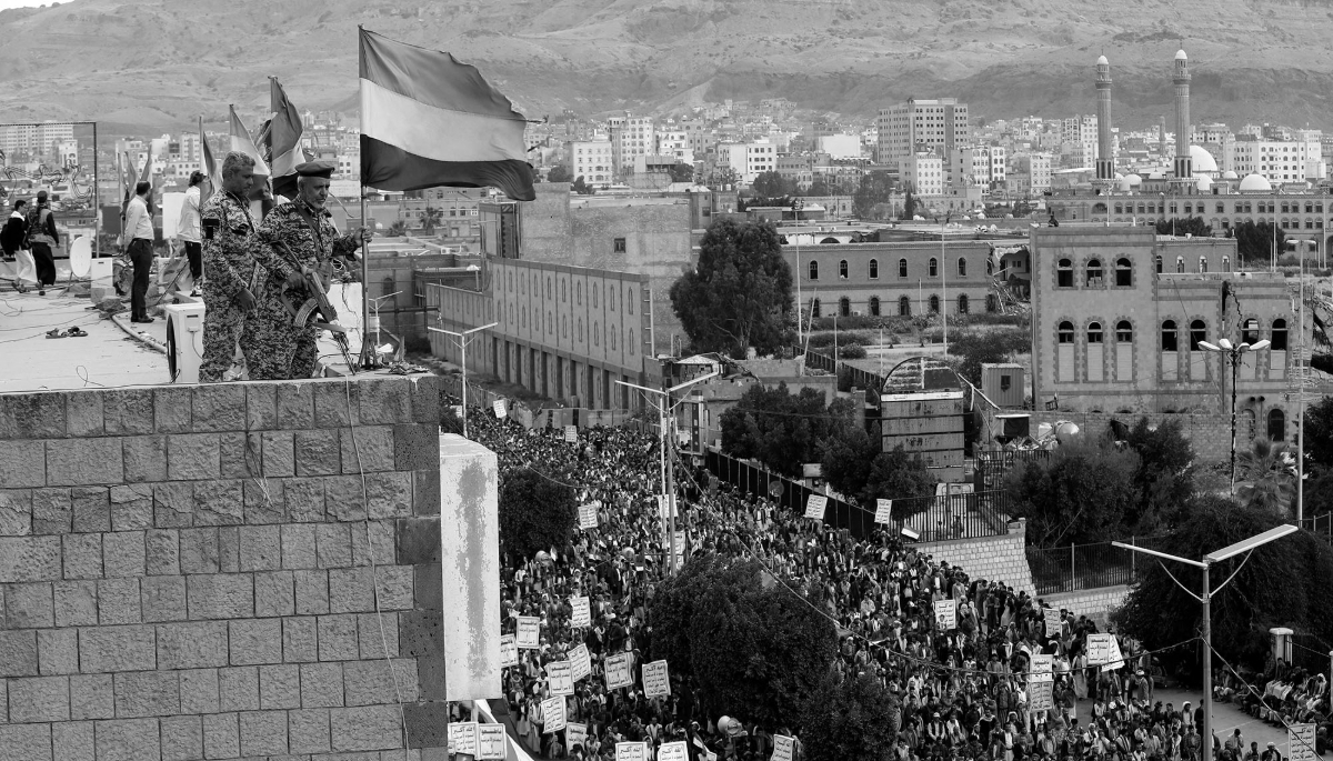 Houthi soldiers stand guard during a demonstration in Sana'a marking the eighth anniversary of Saudi Arabia's military campaign in Yemen, on 26 March 2023. 