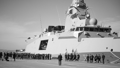 A Greek Navy frigate docked at the port of Piraeus.