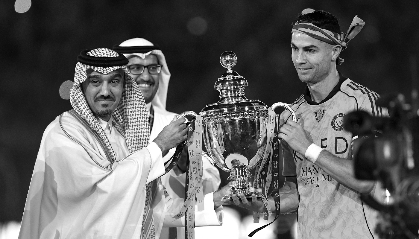 Al-Nassr captain Cristiano Ronaldo receives the Saudi Pro League trophy after winning a match between Al-Nassr and Damac Club in Riyadh in Saudi Arabia, on 21 May 2026.
