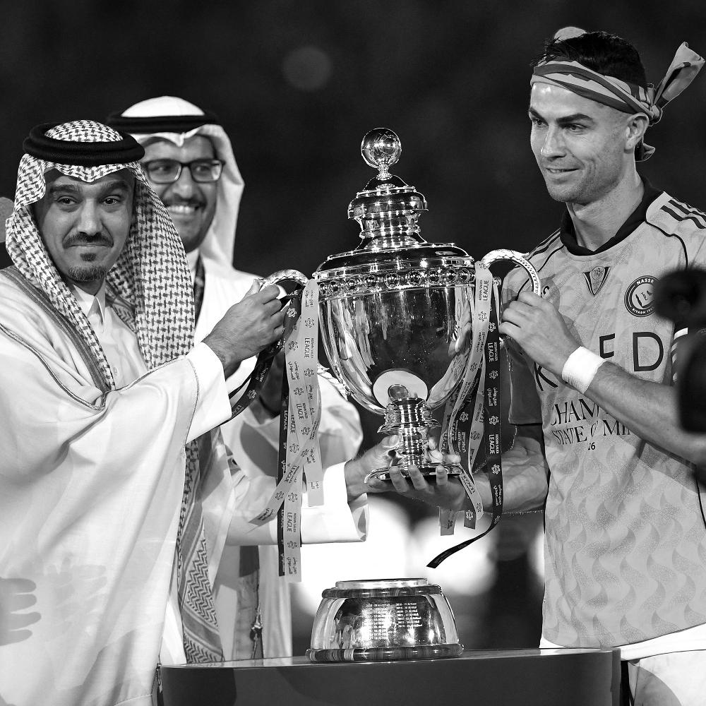 Al-Nassr captain Cristiano Ronaldo receives the Saudi Pro League trophy after winning a match between Al-Nassr and Damac Club in Riyadh in Saudi Arabia, on 21 May 2026.