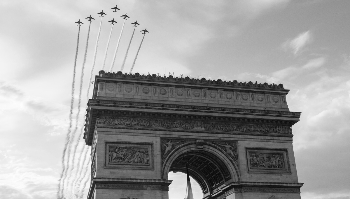 Jets from the French Air Force Patrouille de France fly over the Arc de Triomphe in Paris on 8 May 2025.
