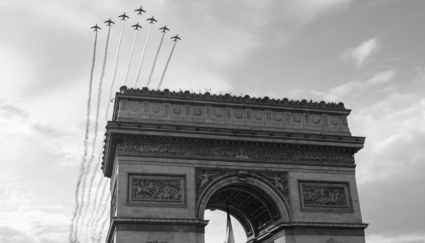 Jets from the French Air Force Patrouille de France fly over the Arc de Triomphe in Paris on 8 May 2025.