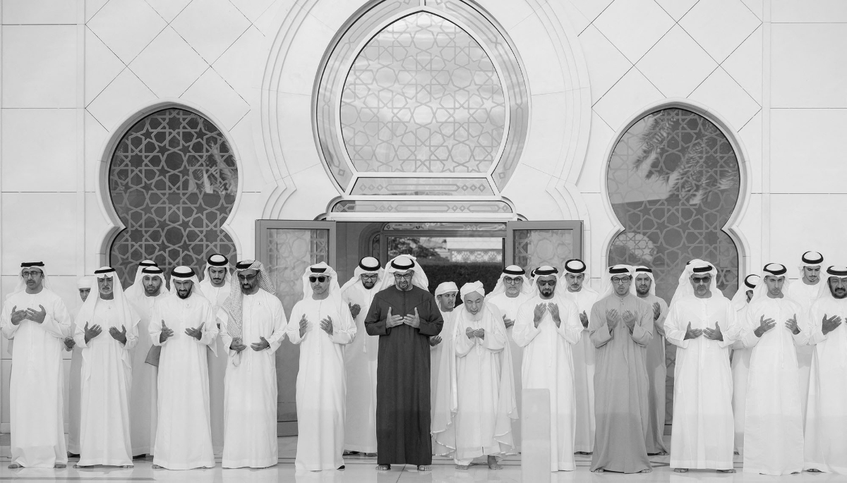 UAE President Mohamed bin Zayed Al Nahyan prays alongside Vice President Mansour bin Zayed Al Nahyan in Abu Dhabi, 10 April 2024. 