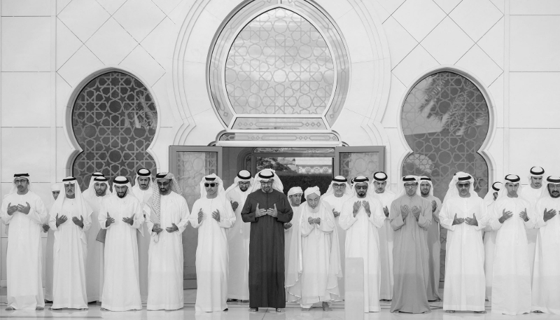 UAE President Mohamed bin Zayed Al Nahyan prays alongside Vice President Mansour bin Zayed Al Nahyan in Abu Dhabi, 10 April 2024. 