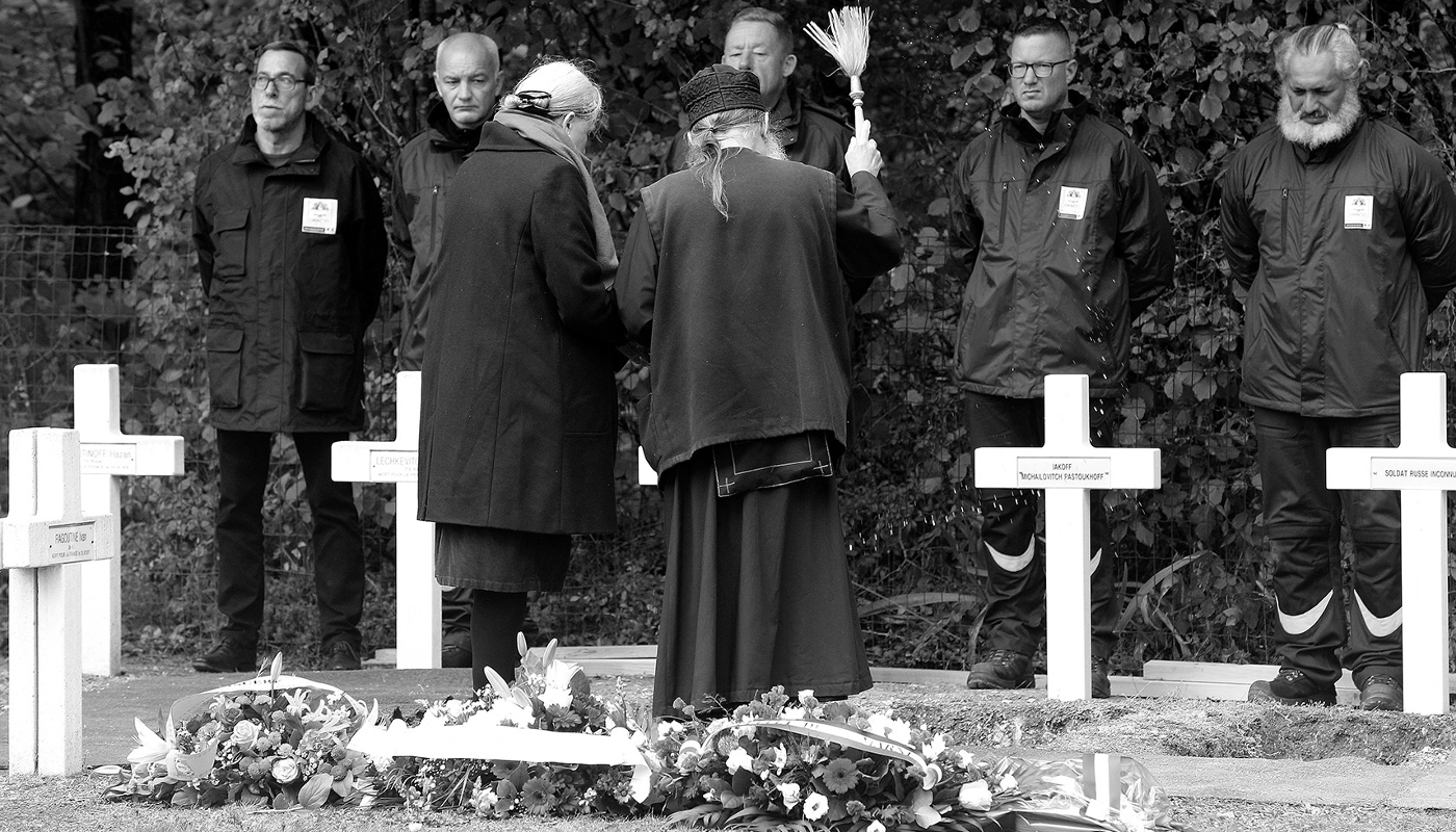 A priest at the graves of three Russian soldiers from WWI, at The National Cemetery of Saint-Hilaire-le-Grand, France, 27 October 2023.