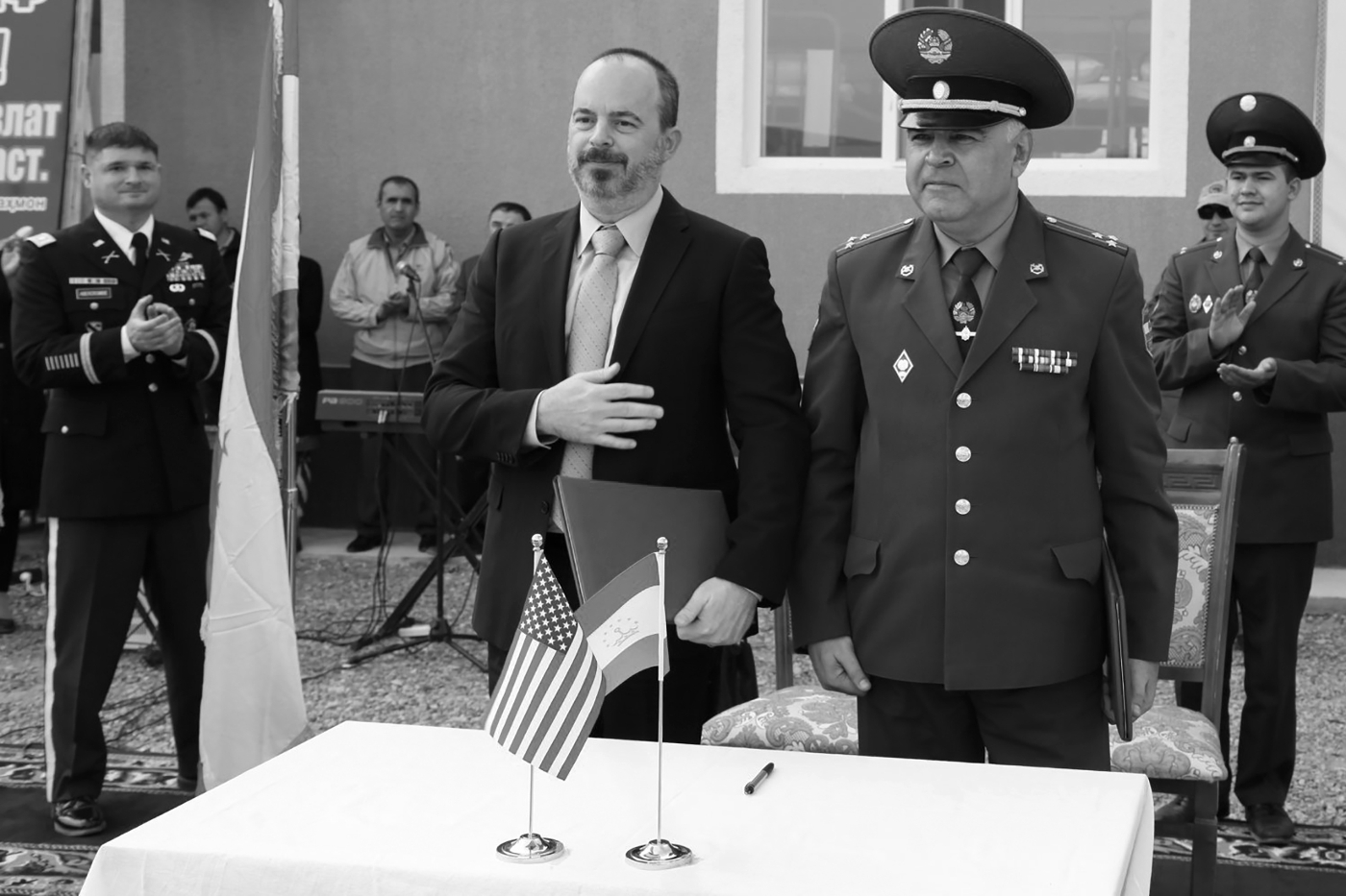 United States chargé d'affaires John Ginkel, and Colonel Shohiyon Abdusattor, deputy commander of Tajikistan's Border Guard Forces, participated in the opening ceremony for the Okultun border outpost, in 2019.