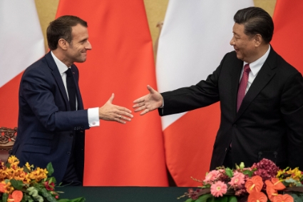 Emmanuel Macron and Xi Jinping.