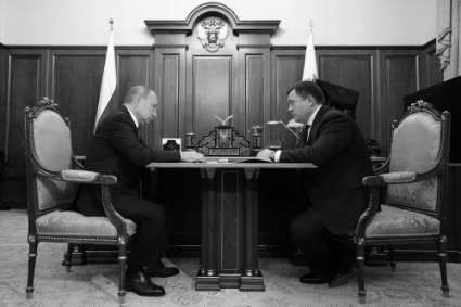 Vladimir Putin and Pyotr Fradkov during their meeting on 20 December 2021.