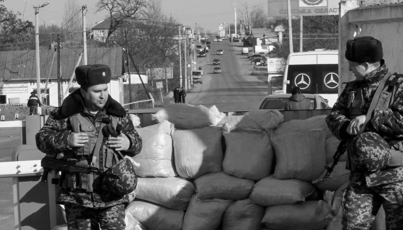 Ukrainian border guards stand at a checkpoint at the border with Moldova breakaway Transnistria region, near Odessa.