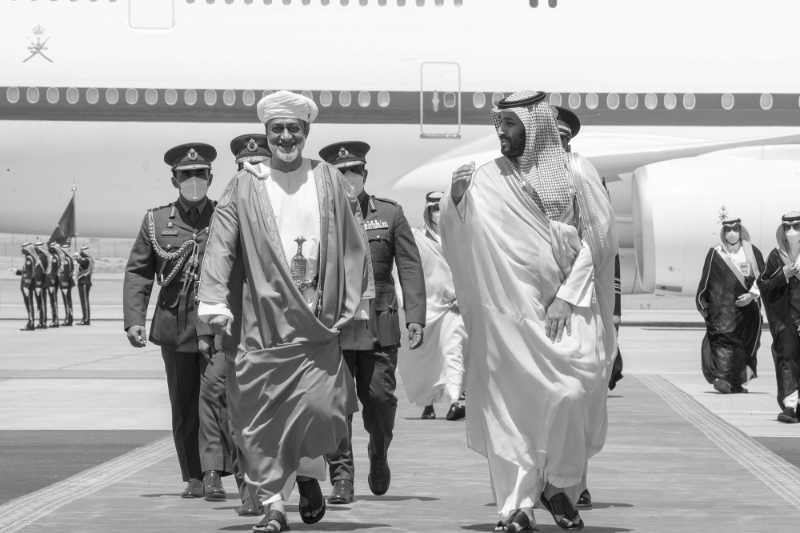 Arabia's Saudi Crown Prince Mohammed bin Salman (R) receiving Sultan of Oman Haitham bin Tarik (L) at Neom Bay Airport.