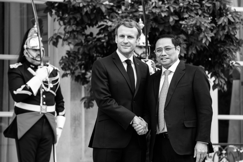 French President Emmanuel Macron welcomes the Prime Minister of the Socialist Republic of Vietnam Pham Minh Chinh at the Elysée Palace.