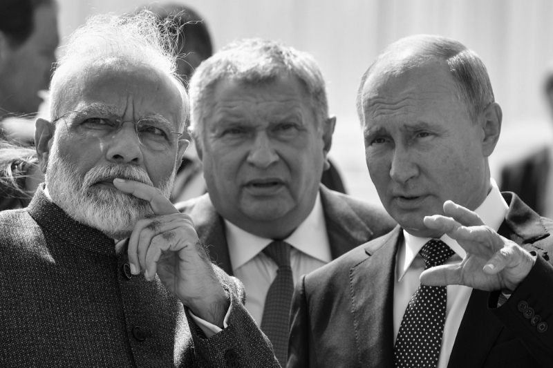 Indian Prime Minister Narendra Modi talks to Russian President Vladimir Putin while visiting the shipyard Zvezda, as Rosneft Russian oil giant chief Igor Sechin accompanies them, outside the far-eastern Russian port of Vladivostok, 4 September 2019, where the Eastern Economic Forum 2019 is hosted by Russia.