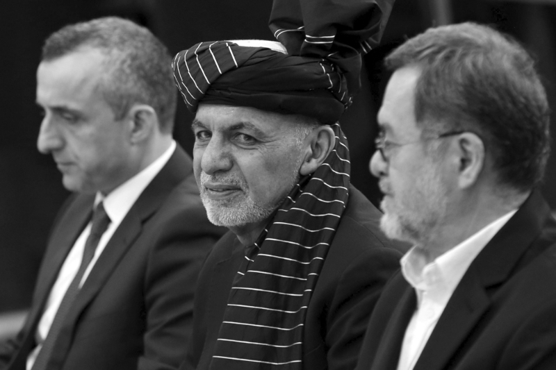 Afghan President Ashraf Ghani, surrounded by candidates Amrullah Saleh (L) and Sarwar Danish (R).