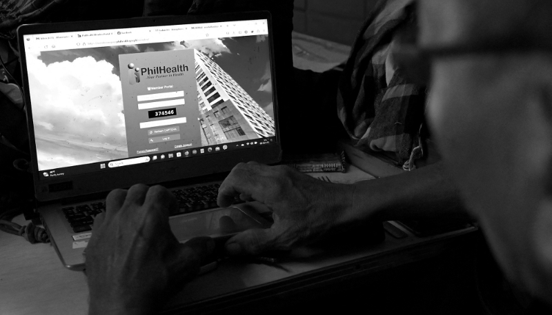 A man tries to access the login page of Philippine Health Insurance Corporation (PhilHealth) in Manila on 9 October, 2023.