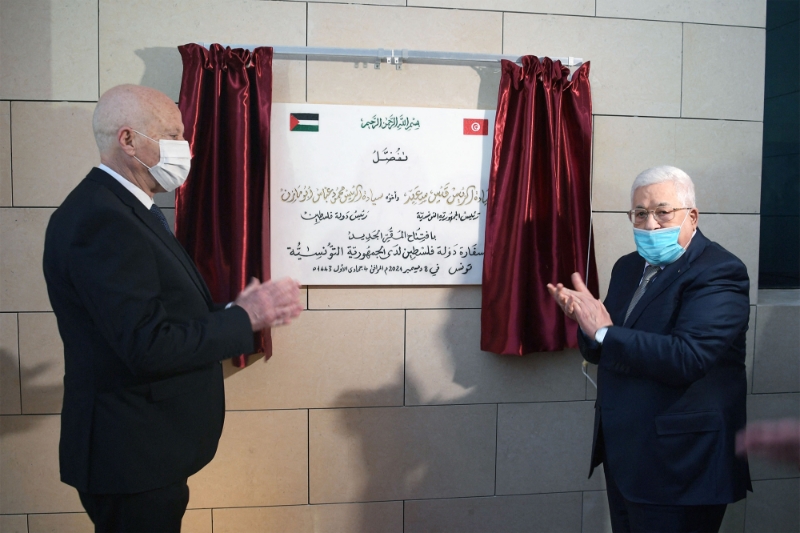 Tunisia's President Kais Saied and Palestinian president Mahmud Abbas inaugurating the new Palestinian embassy headquarters in Tunis on December 8, 2021.