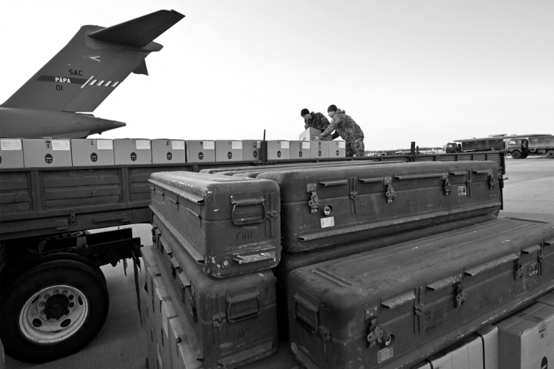 Servicemen of Ukrainian Military Forces load a flat bed truck with boxes of US made FIM-92 Stinger missiles in Boryspil Airport in Kyiv on February 13, 2022.